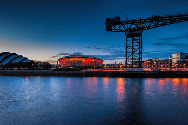 A view of the Glasgow Conference Centre, Hydro and Finneston Crane on the River Clyde at dusk.