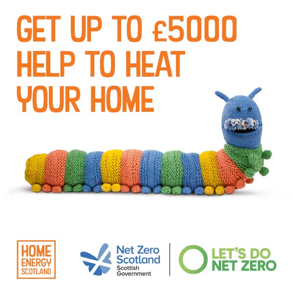 A multicoloured knitted caterpillar draught excluder, with orange text above saying 'Get up to £5000 help to heat your home.'