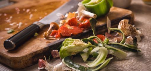 Food waste next to a chopping board