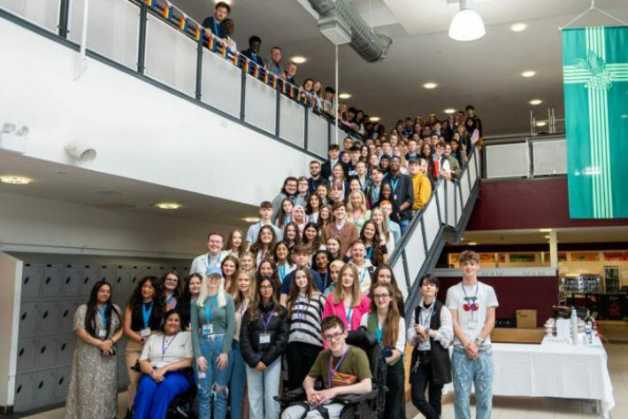 Group of young people posing on stairs