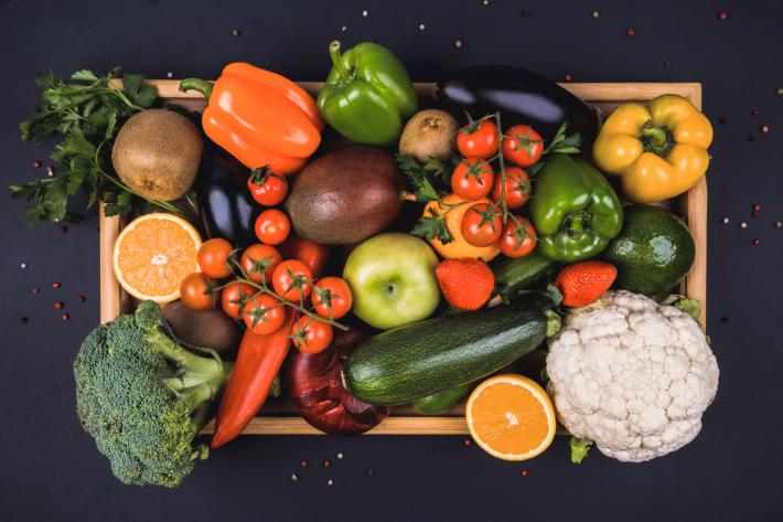 A wooden crate of vegetables