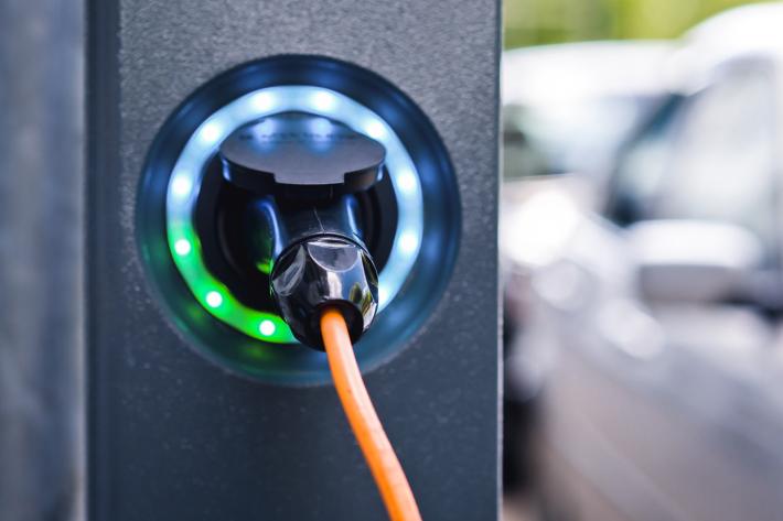 A close up of a plug in a charging point.