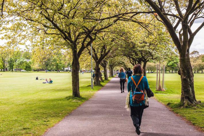 people walking along the Meadows in Edinburgh