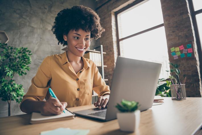 A person sitting at a laptop