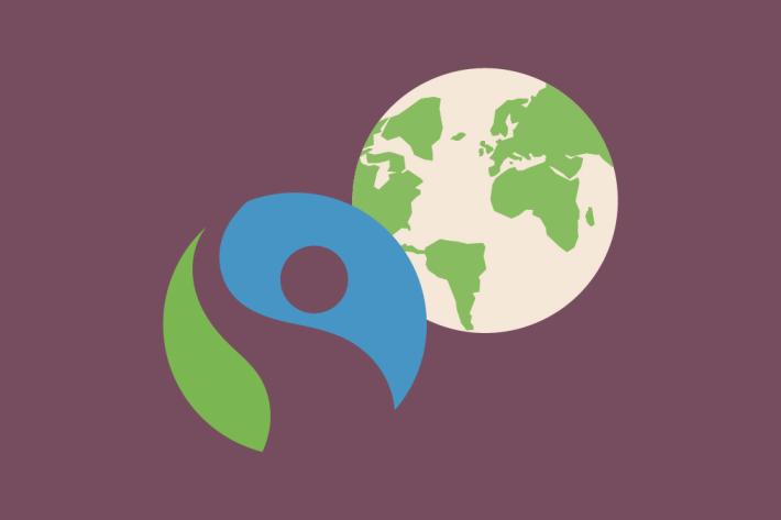 Illustration of fairtrade logo and planet earth on a purple background