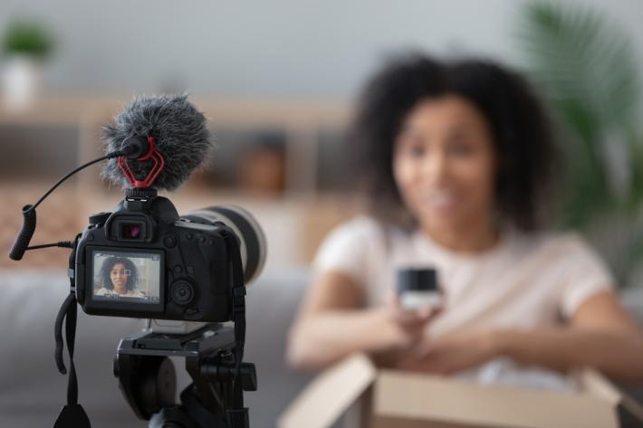 Woman recording video of herself