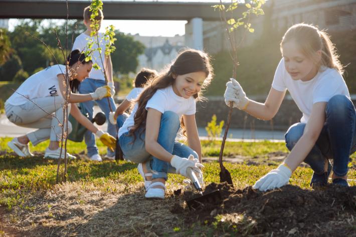 Children outside gardening