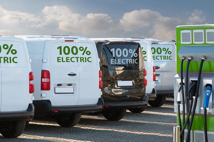 Electric vans at a charging point