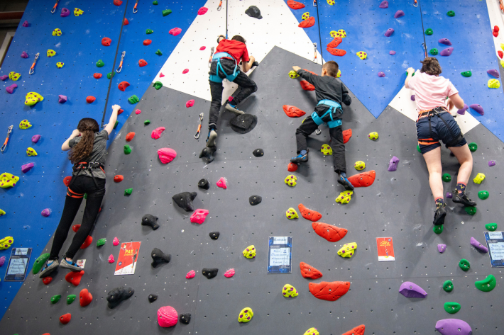 People using a climbing wall