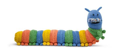A multicoloured, knitted caterpillar draught excluder