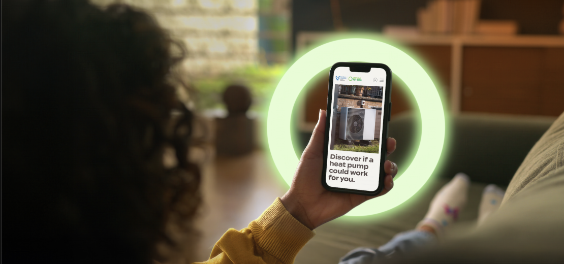 person looking at smartphone with a glowing yellow circle around it