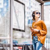 A woman at a bus stop