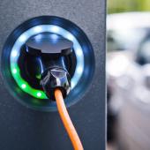 A close up of a plug in a charging point.