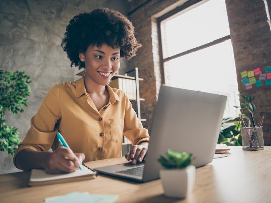 A person sitting at a laptop