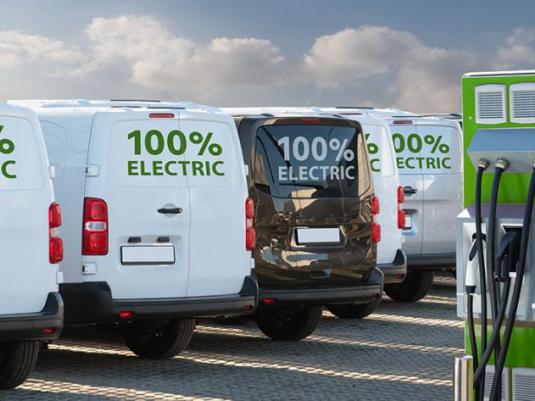 Electric vans at a charging point