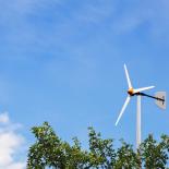 A small wind turbine on top of a house